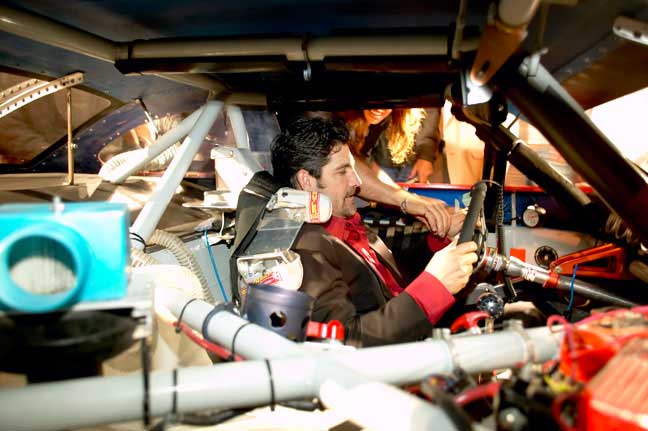 Grant Cardone in the race car cockpit