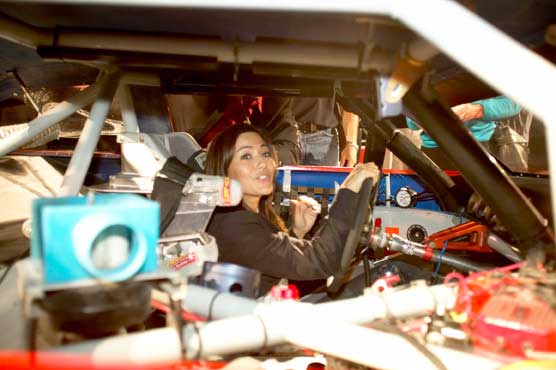 Marisol Nichols experiencing the race car cockpit