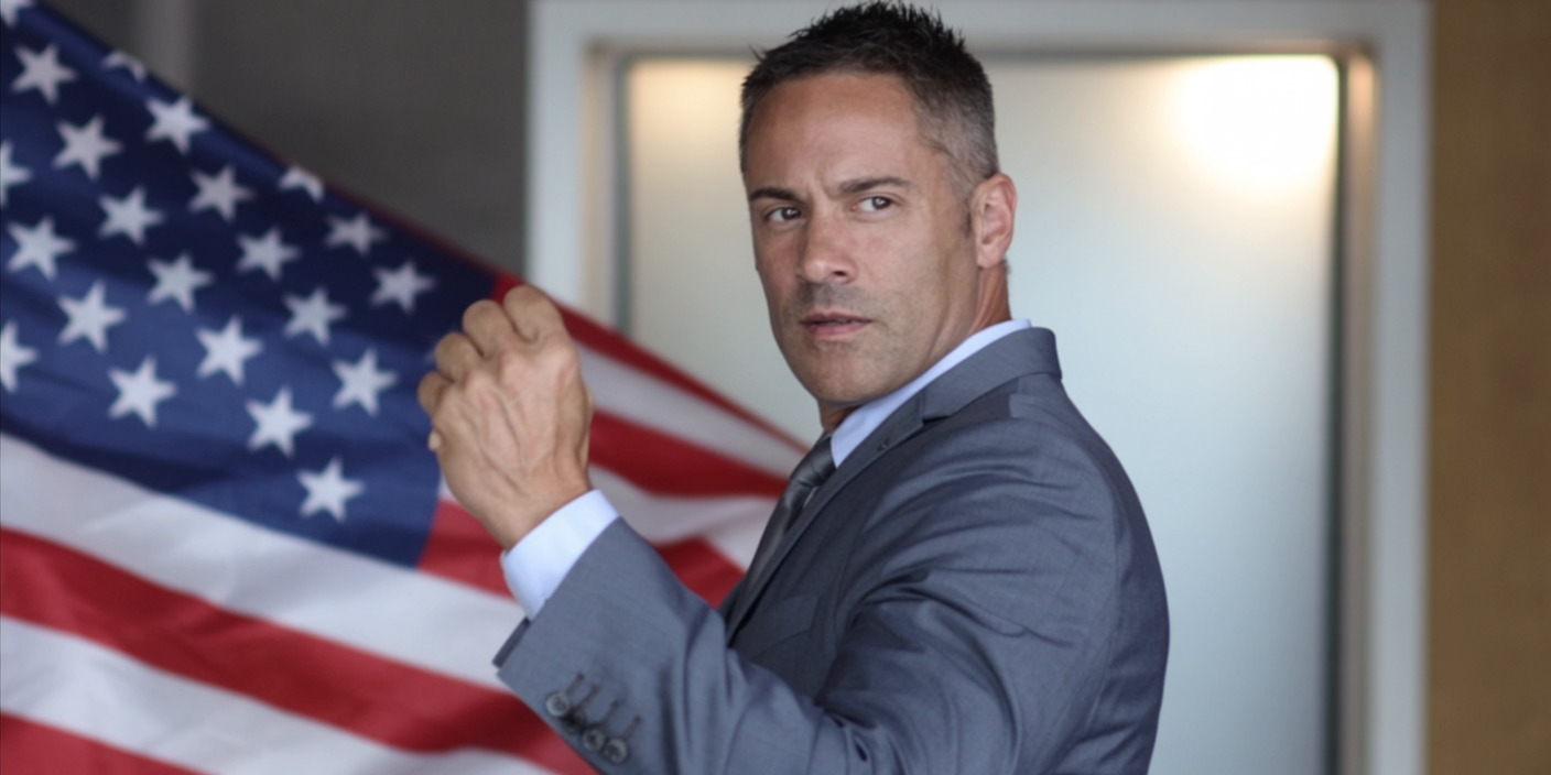 Kenton Gray, Marine Corps veteran and healthcare entrepreneur, with American flag