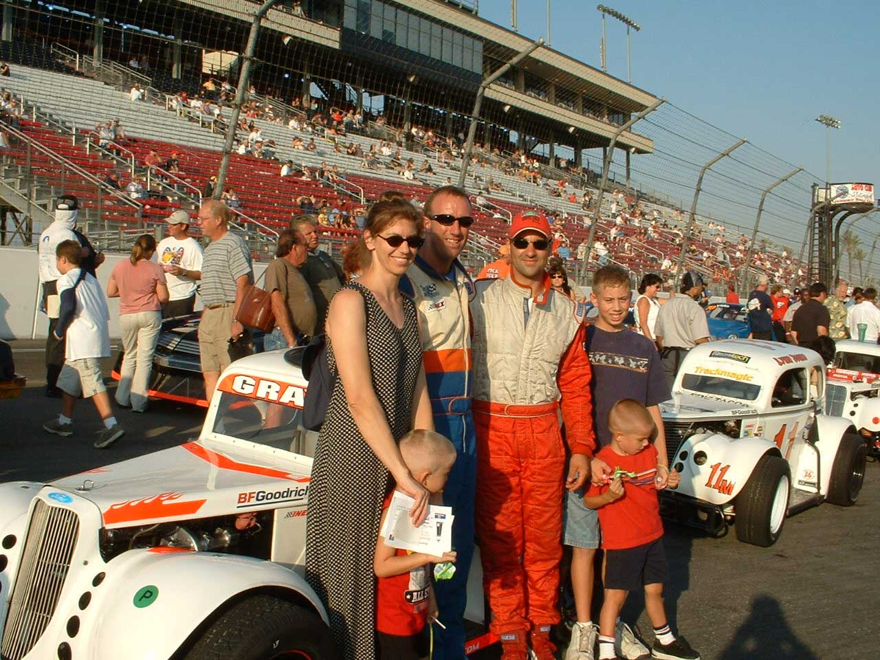 Kenton Gray with champion Tom Landreth and families at track