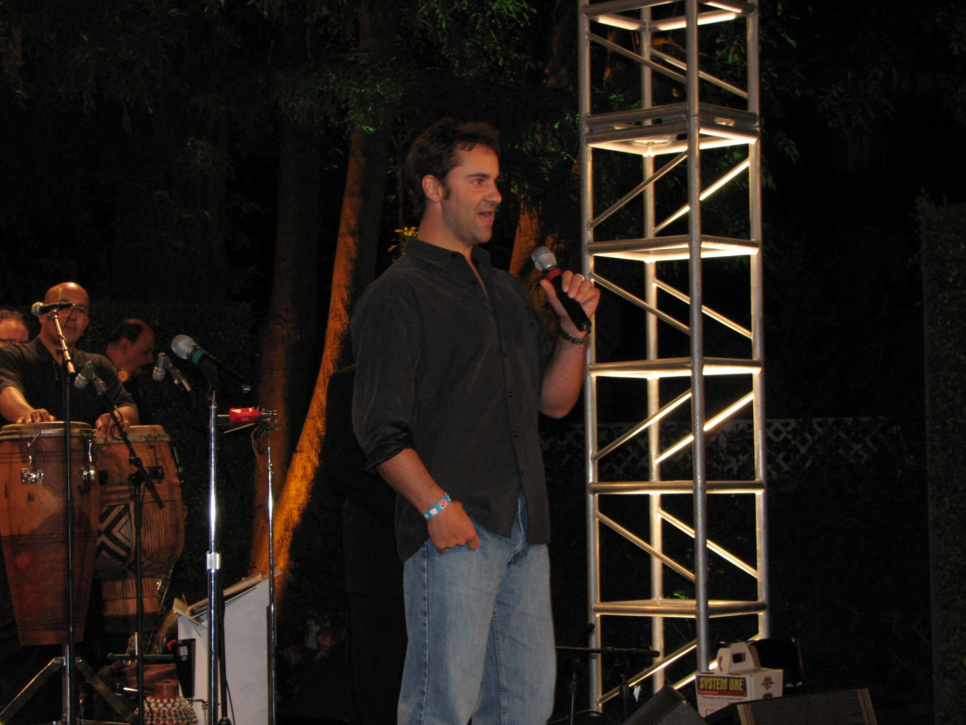 Kenton Gray speaking on stage at PALS Casino Night