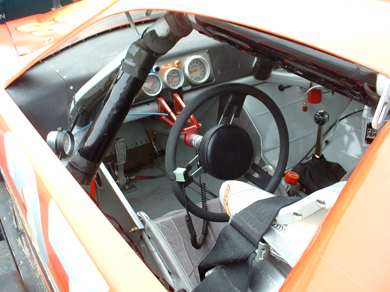 Race car cockpit dashboard and gauges