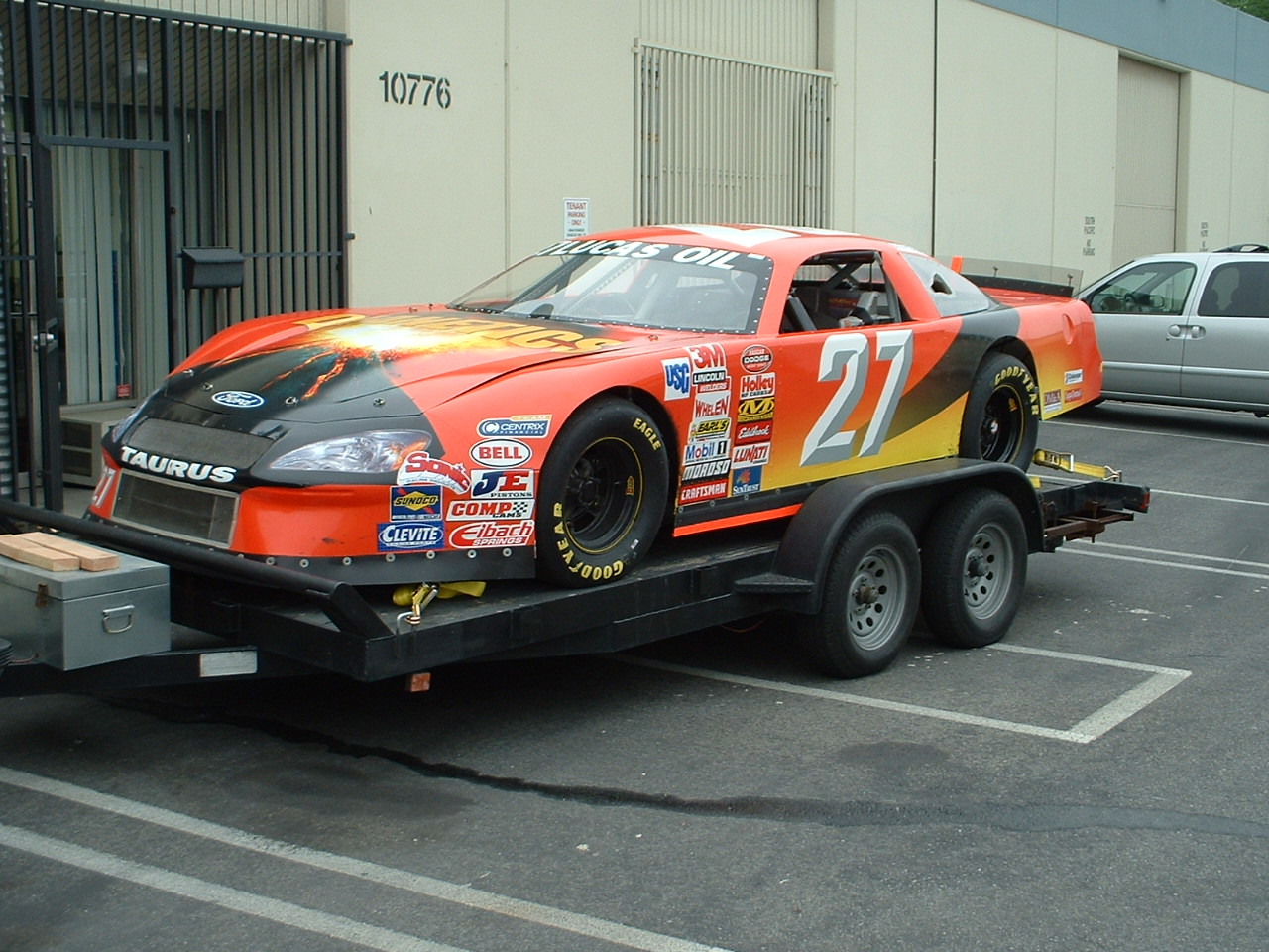#27 Ford Taurus race car on trailer