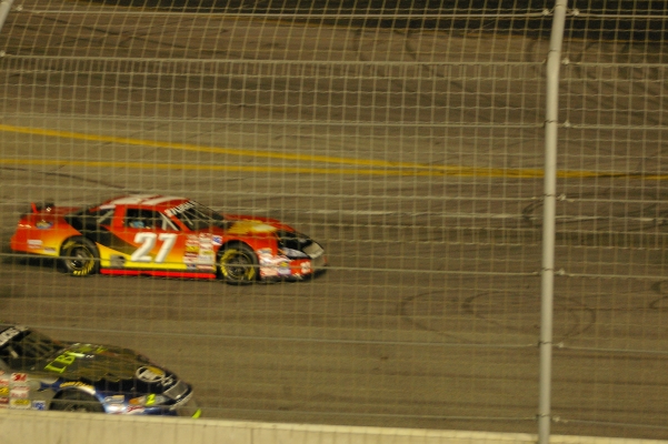 Dianetics #27 car racing on track at night