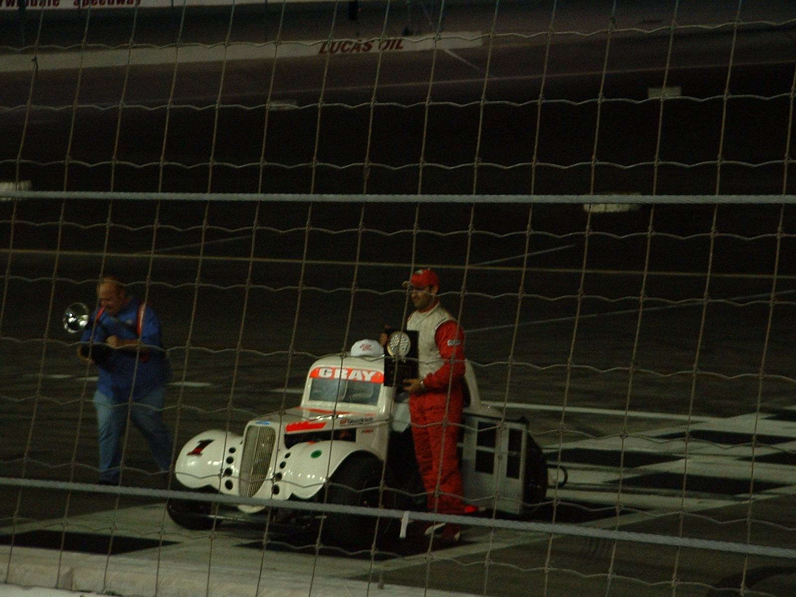 Victory lane celebration with trophy